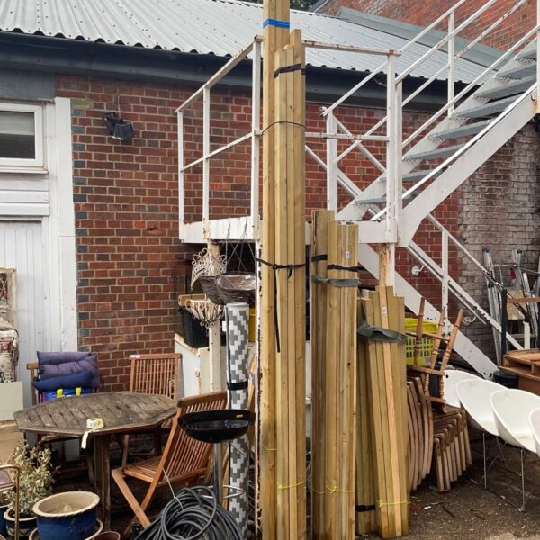 Timber bundles in a garden setting, ready for DIY projects.