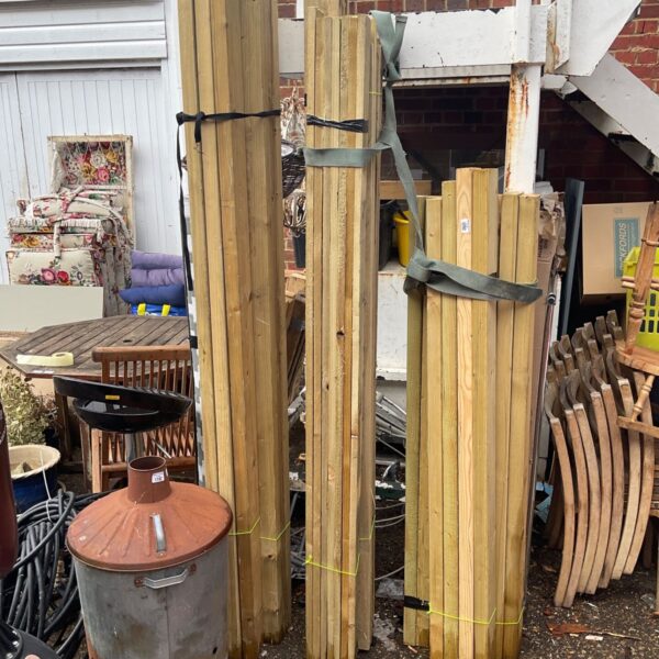 Stacked timber bundles, softwood lumber for construction and DIY projects.