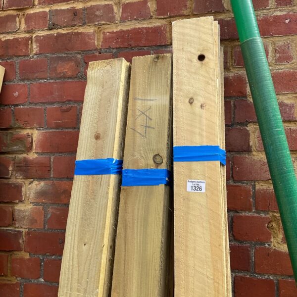 Three bundles of 6’6” timber secured with plastic strapping.
