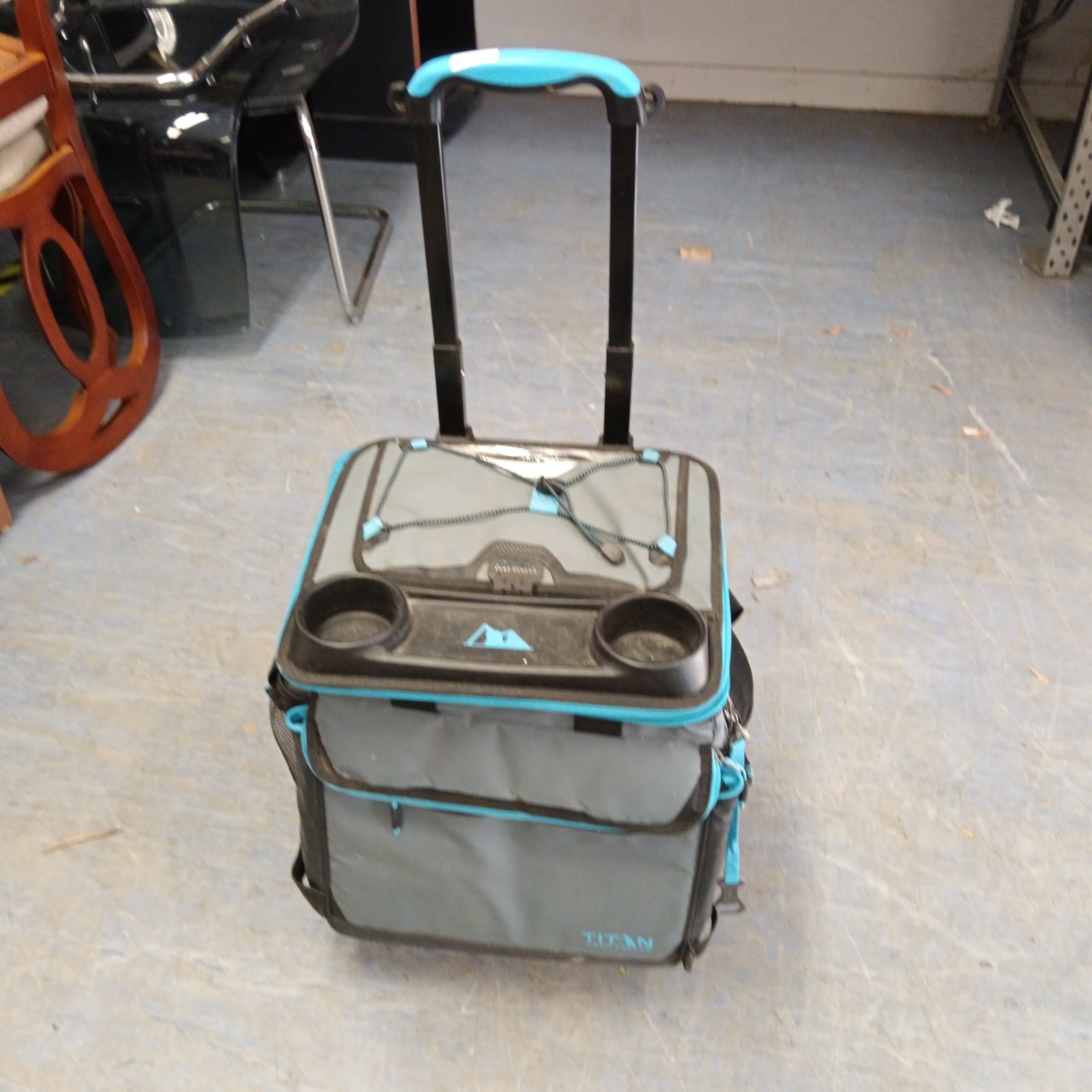 Titan toolbox on wheels with black and grey exterior.