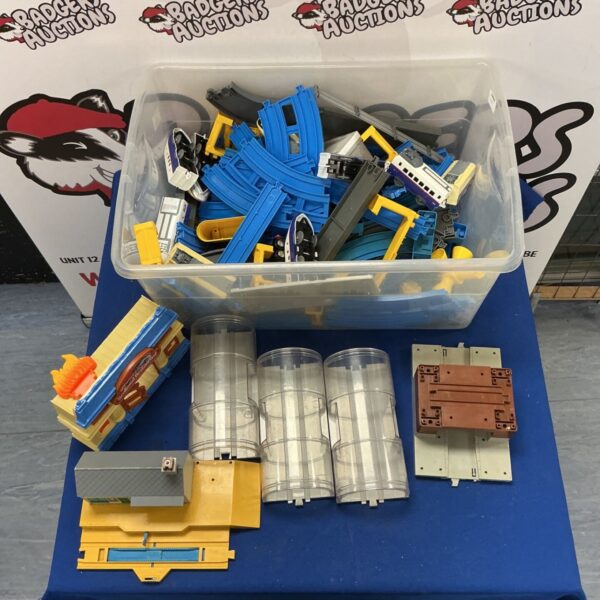 Tomy train track set with trains and scenery in a box.