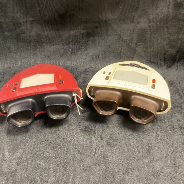 Vintage Tomytronic 3D games, red and white handheld consoles.