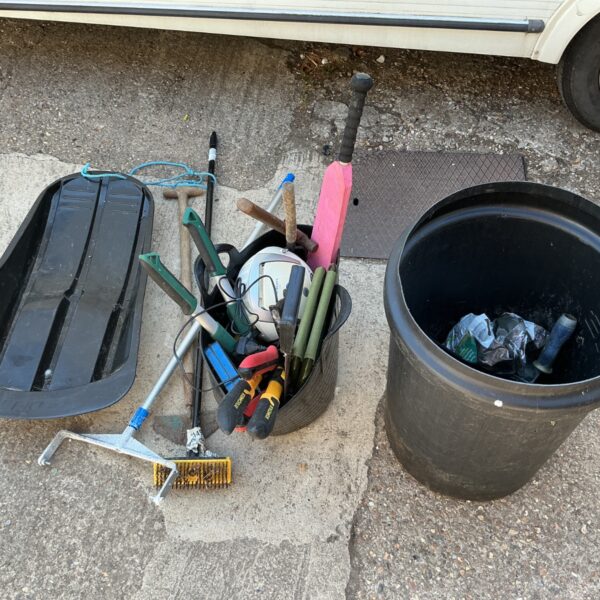 Mixed lot of garden tools, a sled, and a dismantled CD player.