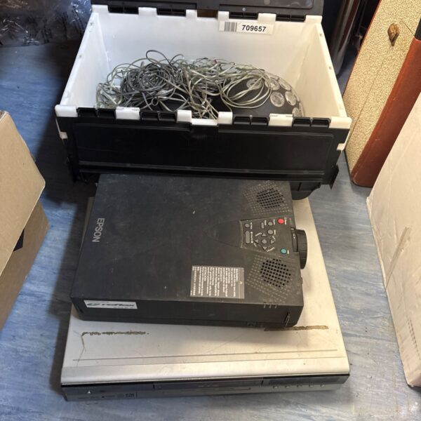 Toshiba video recorder and plasma lights in a storage box.