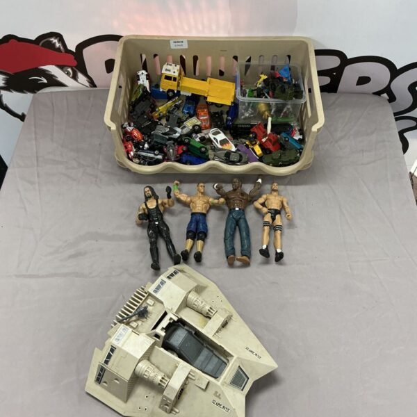 Mixed toy bundle with Star Wars ship and WWE figures.