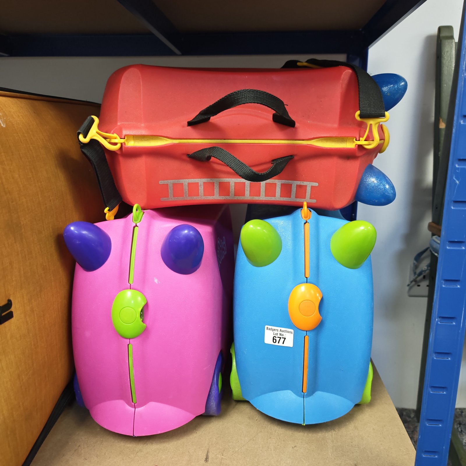 Colourful set of three Trunki kids suitcases for travel.