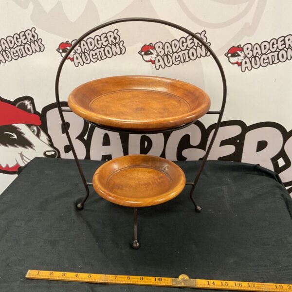 Vintage two tier wrought iron bowl stand with wooden bowls.