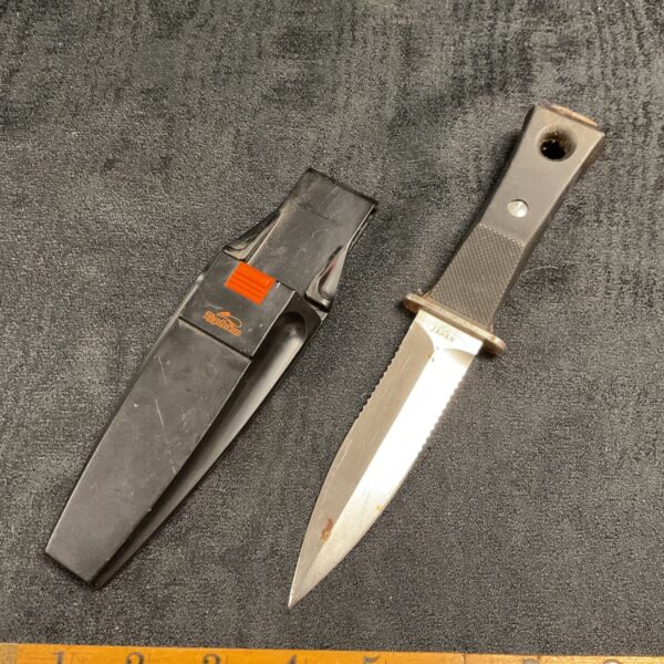Vintage Typhoon Japan divers knife with sheath, ideal for collectors.