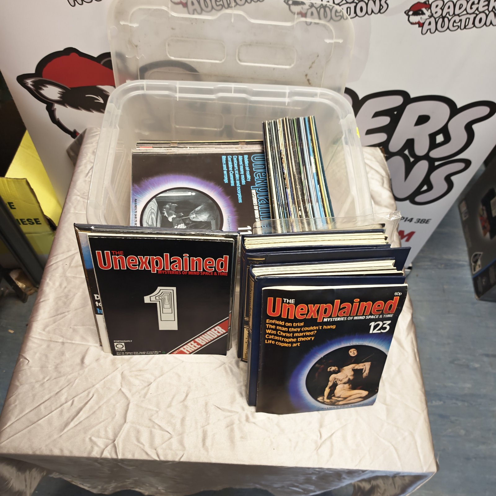 Vintage lot of Unexplained Mysteries magazines with presentation folders.