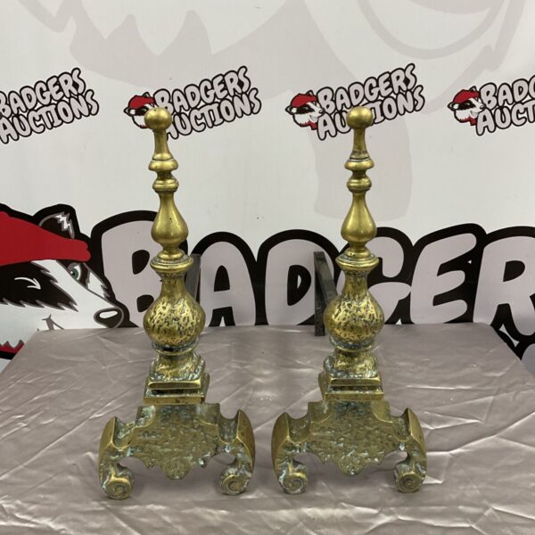 Ornate Victorian brass fire dogs with ball finials and scrollwork feet.