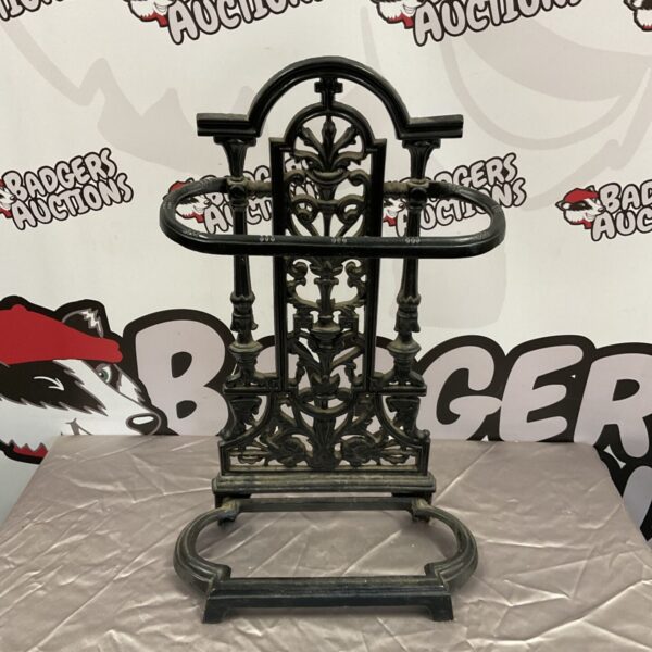 Ornate Victorian cast iron stick stand for umbrellas and walking sticks.