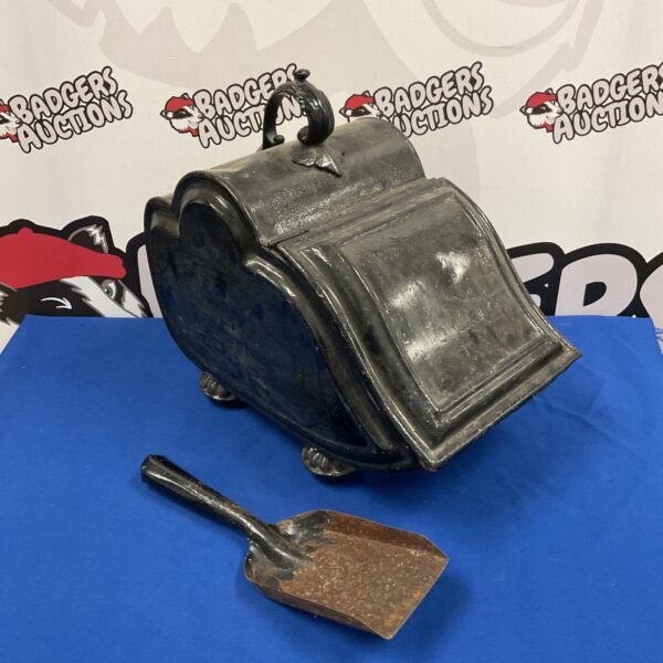 Antique Victorian coal purdonium with a japanned finish.