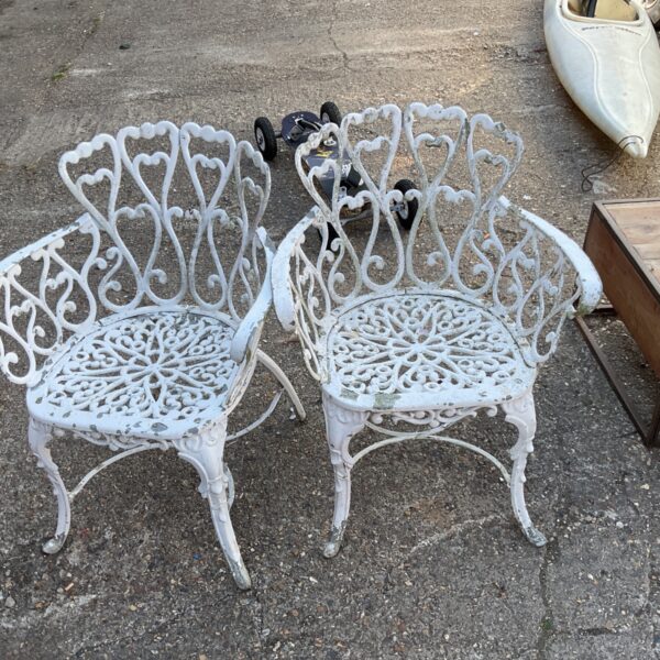 White painted Victorian garden armchair with heart-back detail.