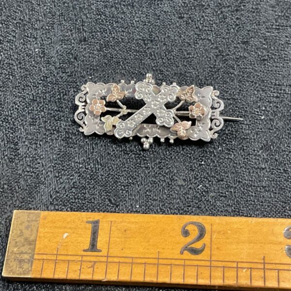 Antique Victorian sweetheart brooch with gold and silver detailing.