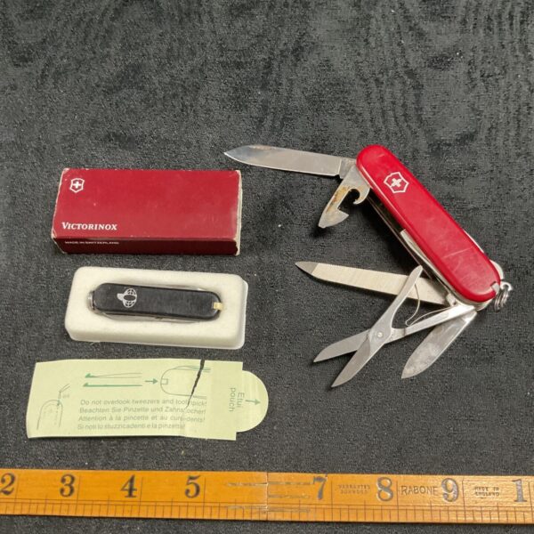 Vintage Victorinox Swiss Army knife, red handle, open blade.