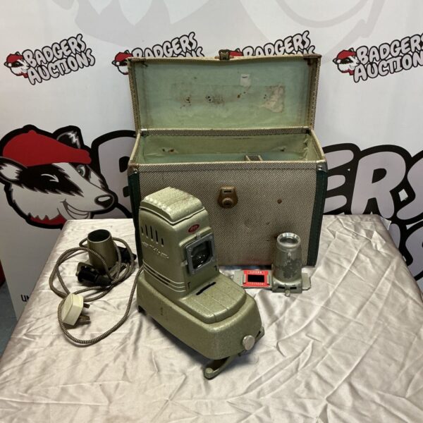 Vintage Aldis slide projector with power cord, a classic photography item.