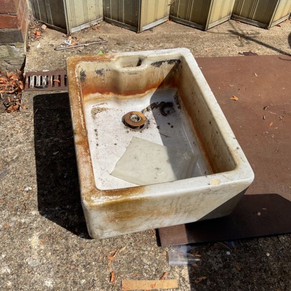 Vintage Armitage Shanks Belfast sink with weathered glaze.