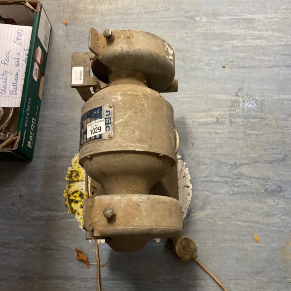 Vintage dual-wheel bench grinder for metalworking and tool sharpening.