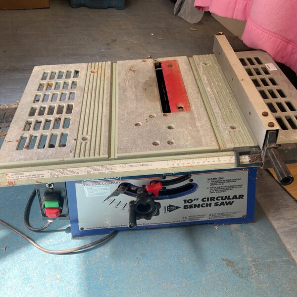 Vintage 10 inch circular bench saw for woodworking.