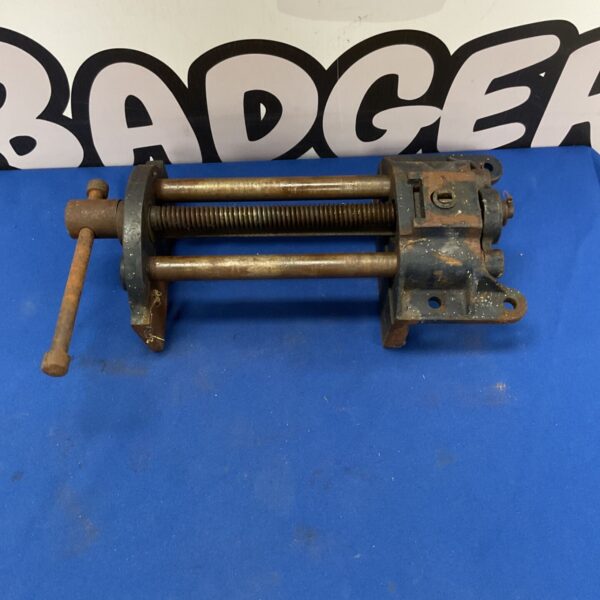 Vintage cast iron bench vise for woodworking and metalworking.