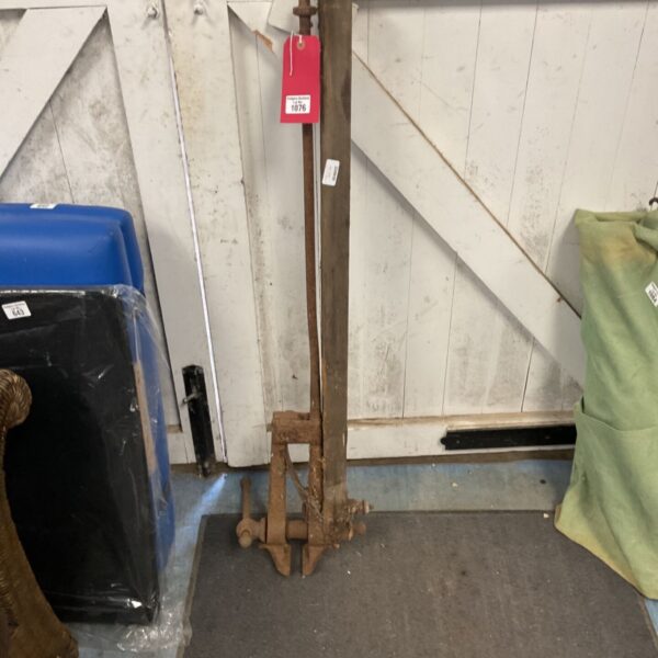 Vintage blacksmith vice with cast iron base, ideal for metalworking.