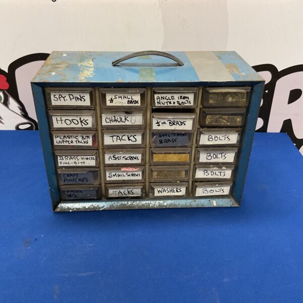 Vintage blue metal parts cabinet with multiple drawers for small parts storage.