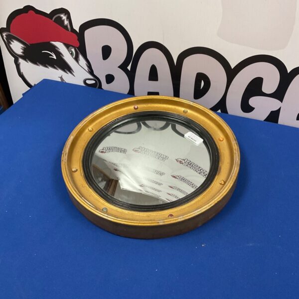 Vintage Bradart 14 inch circular mirror with metal frame.