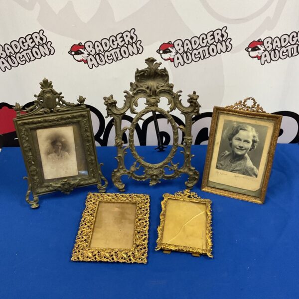 Ornate vintage brass picture frame with a photograph inside.