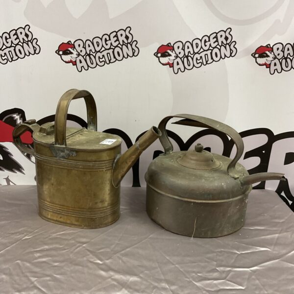 Vintage brass watering can for garden use and display.