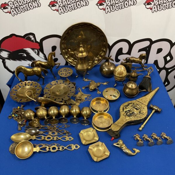 Vintage brassware collection featuring horses and a trinket pot.