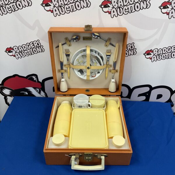 Vintage Brexton picnic set with plates and cutlery inside a case.