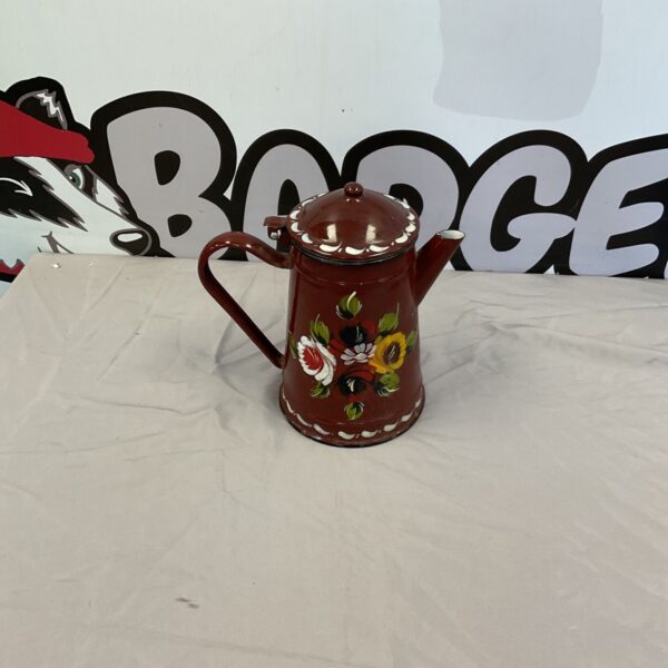 Vintage brown enamel teapot with floral decoration.