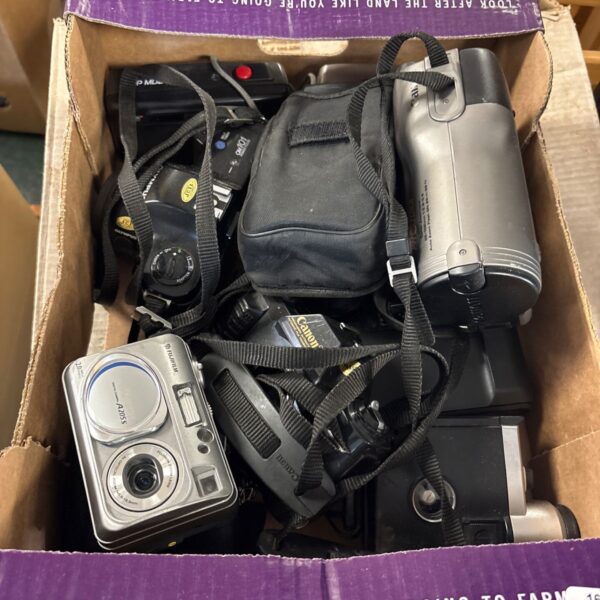 Mixed lot of vintage Fujifilm, Canon, and Olympus film cameras.