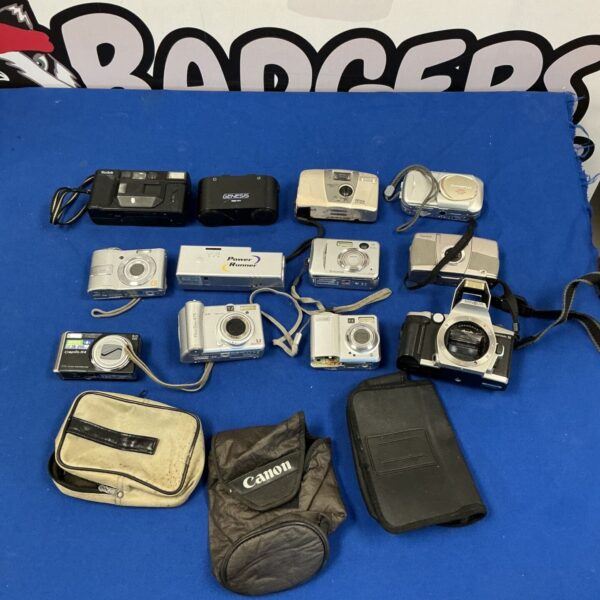 Vintage camera lot including Kodak, Canon, and Fujifilm cameras.