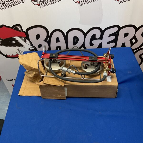 Vintage enamel camping stove for outdoor cooking and collecting.