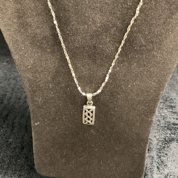 Vintage silver Celtic pendant necklace with intricate knotwork.