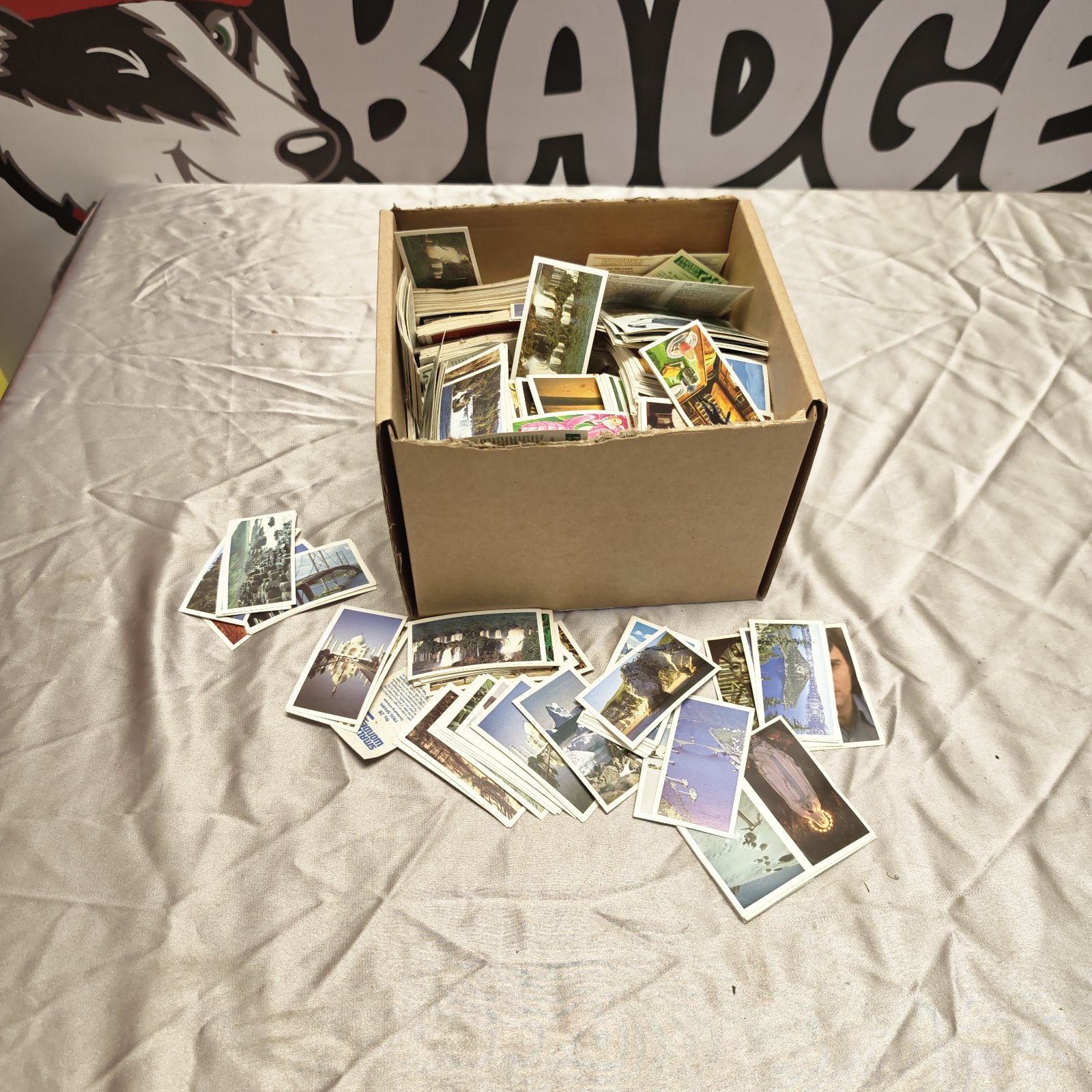 Box of vintage cigarette cards for collectors.