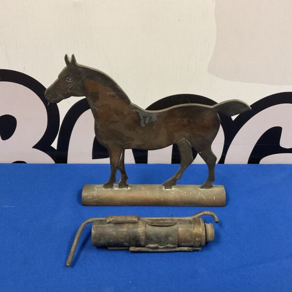 Vintage copper horse finial with WWI era trench lighter, antique collectible.