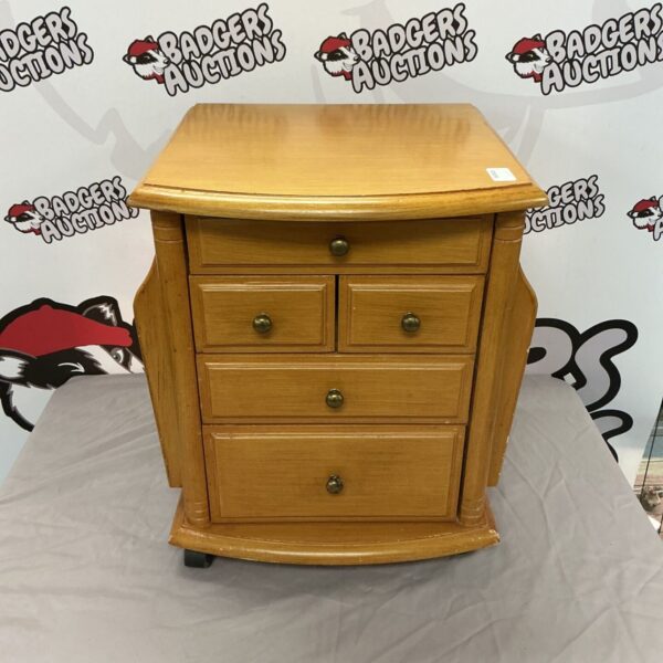 Vintage wooden crafting drawer set for hobby storage.