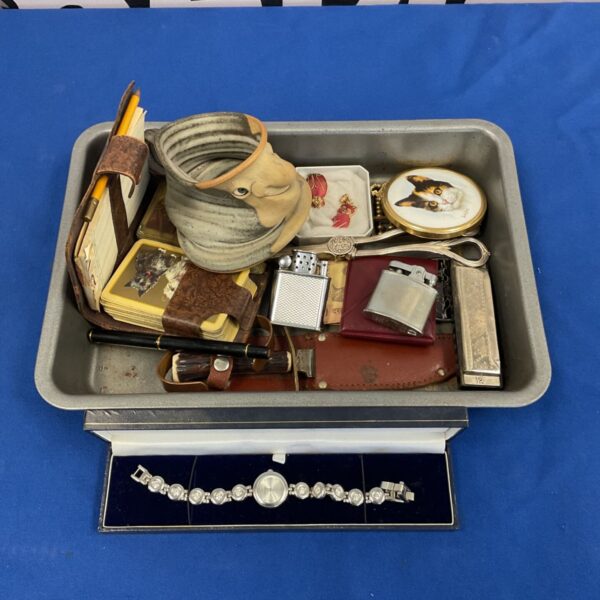 Vintage curios tray with Ronson lighter and horn handle knife.