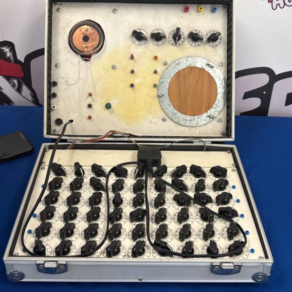Vintage custom testing unit with rotary controls in flight case.