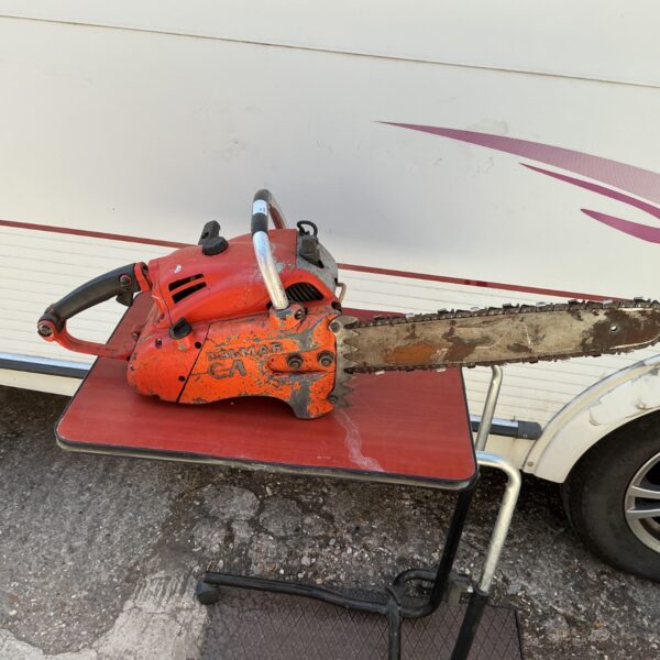 Vintage Dolmar CA chainsaw in used condition, ideal for collectors.