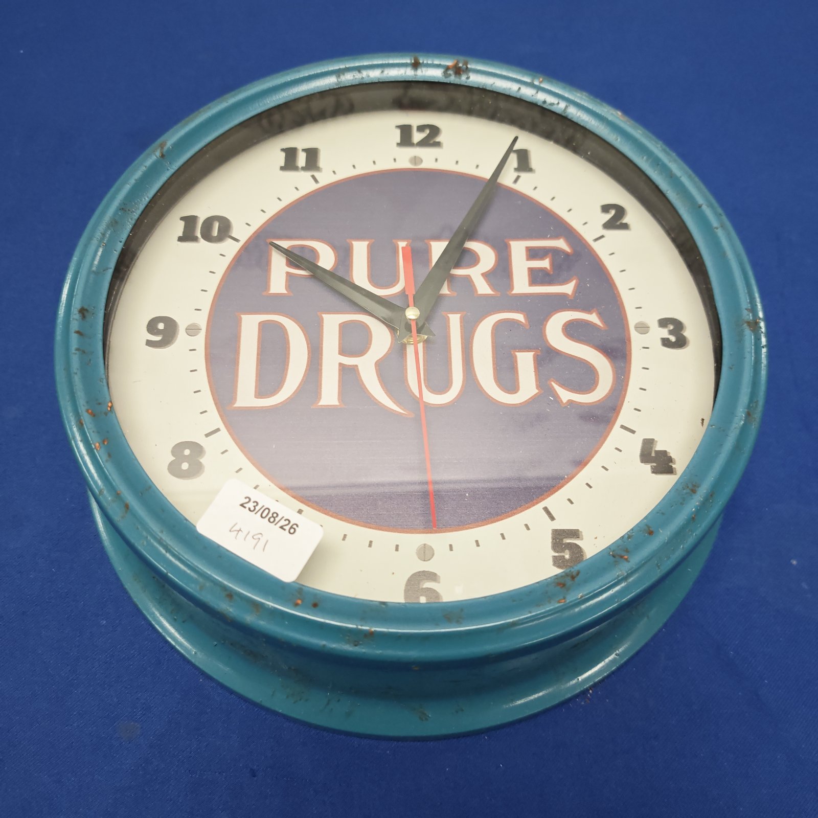 Vintage turquoise drug store advertising wall clock.