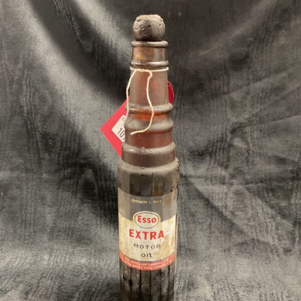 Vintage Esso oil bottle with label and contents.