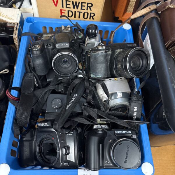 Mixed lot of vintage film cameras including Olympus and Fuji film models.