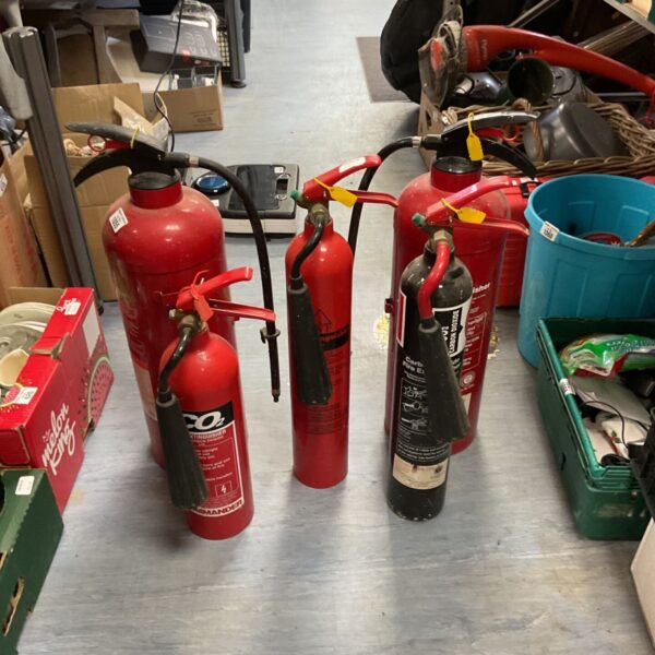 Lot of vintage red fire extinguishers for collectors.