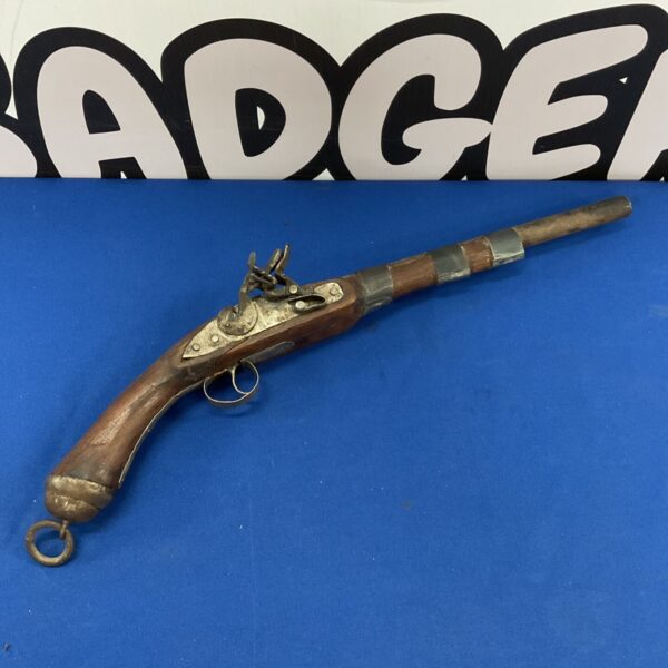Antique flintlock pistol, a vintage firearm for collectors and wall decor.