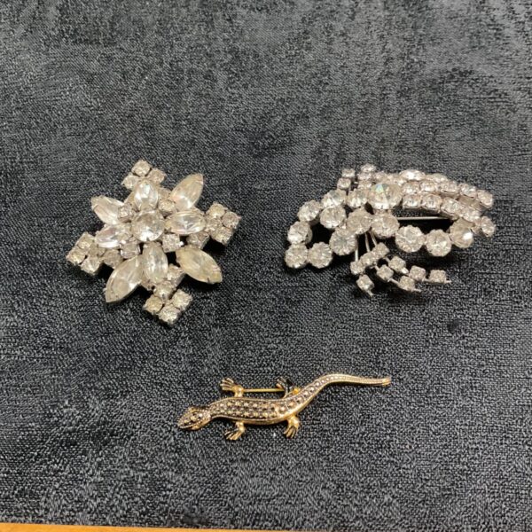 Silver tone vintage floral brooch, delicate and collectible.
