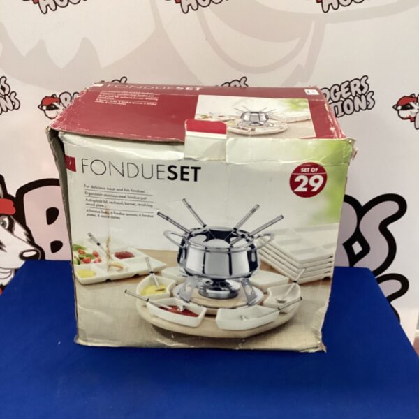 Vintage 29-piece fondue set with cast iron pot and accessories.