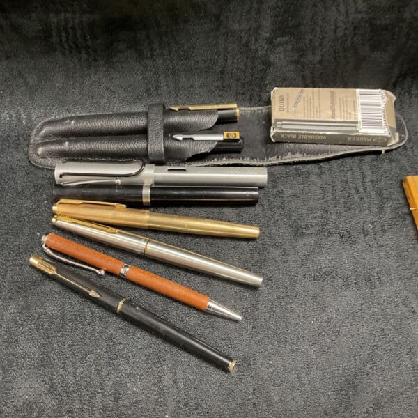 Vintage tin of fountain pens including Parker models.